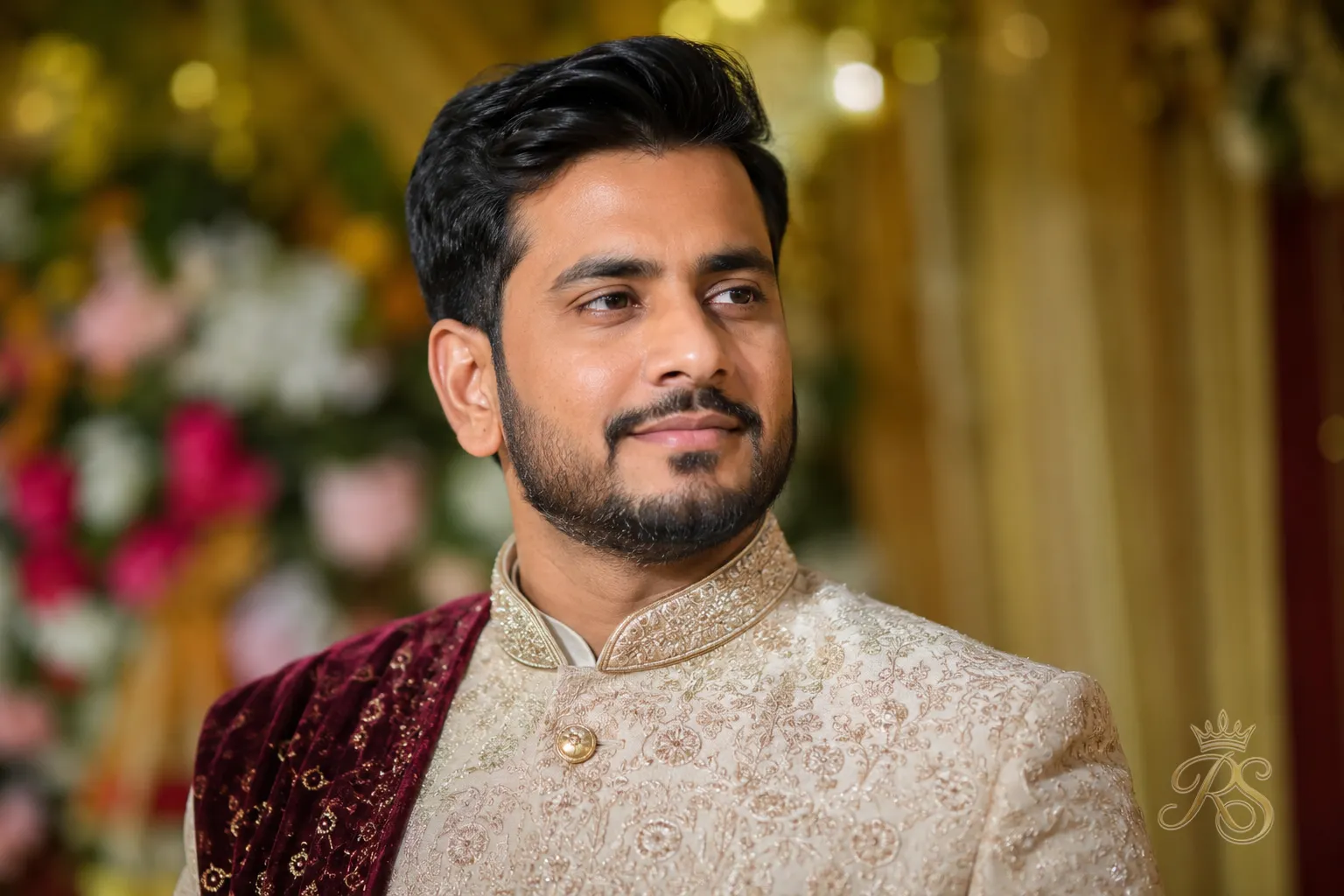 Final portrait of a groom confidently wearing a well-tailored bandhgala jacket at his wedding