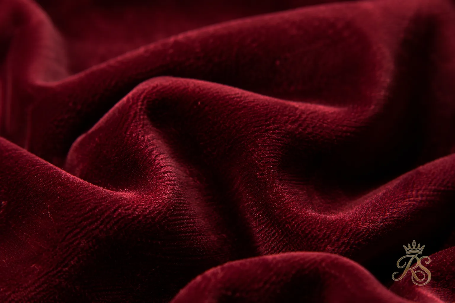 Close-up of rich velvet bandhgala jacket fabric texture in deep maroon