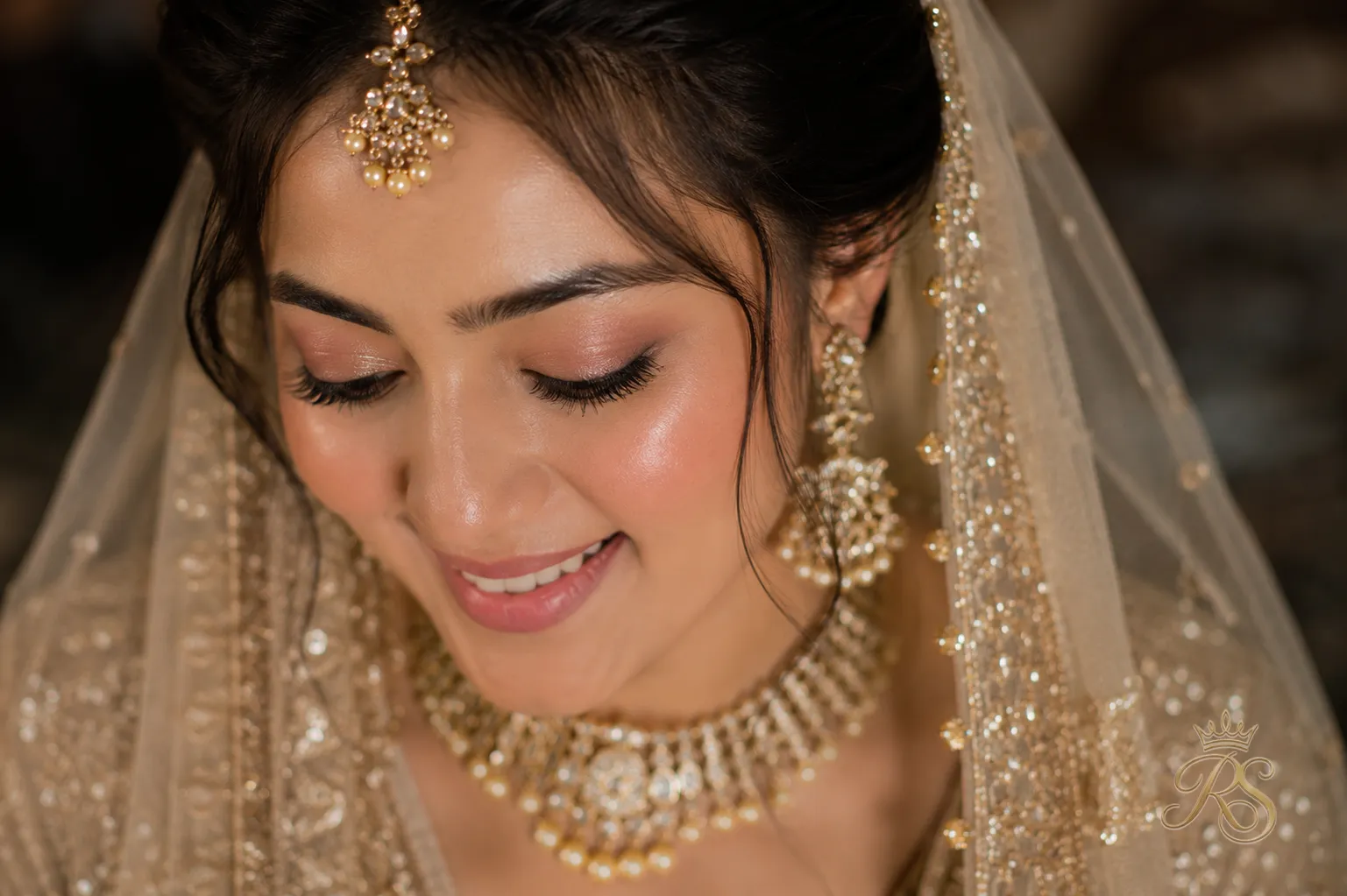 Closeup portrait of dewy natural bridal makeup with soft eye definition