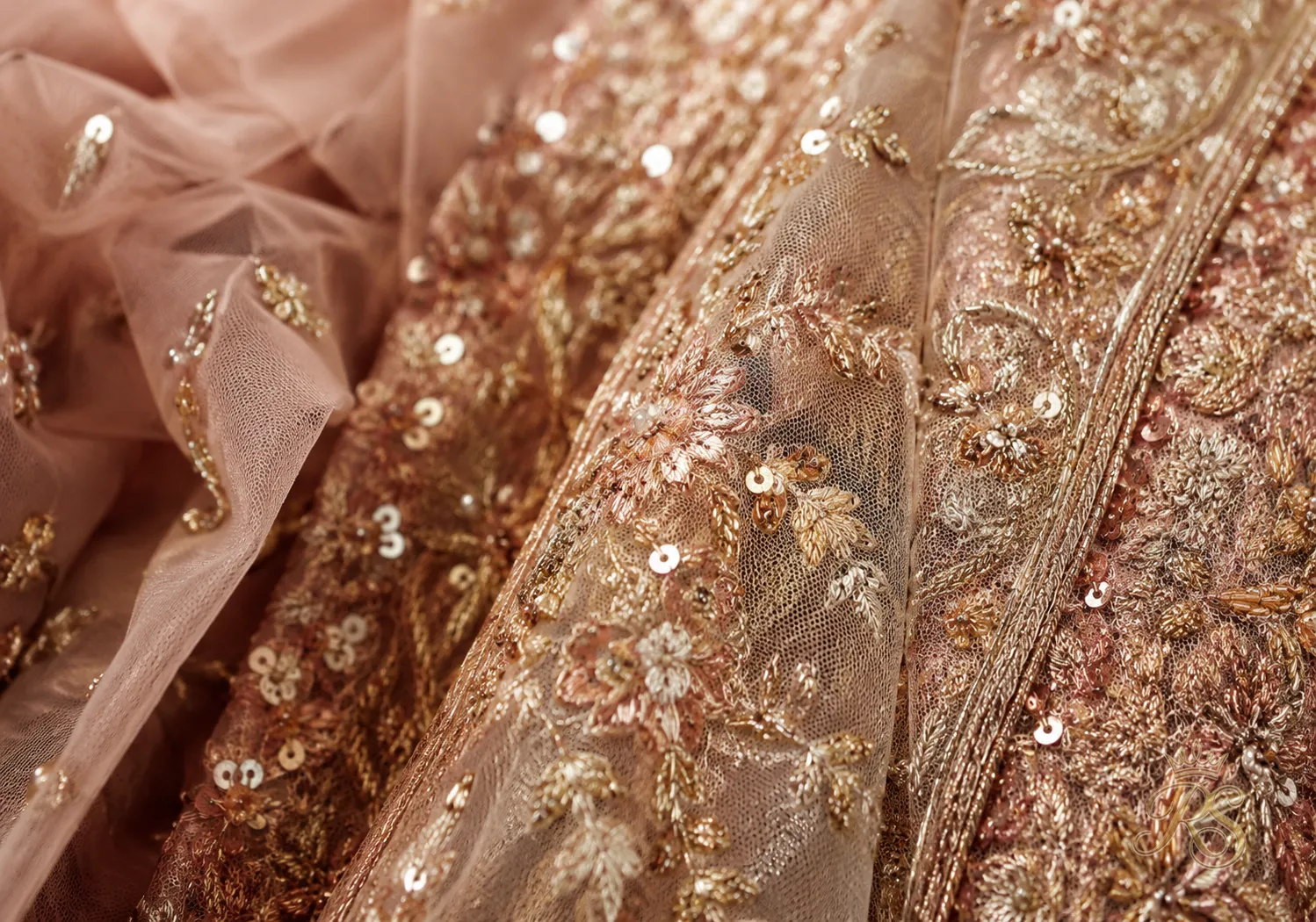 Close-up of a heavy embroidered net bridal dupatta with zardozi work