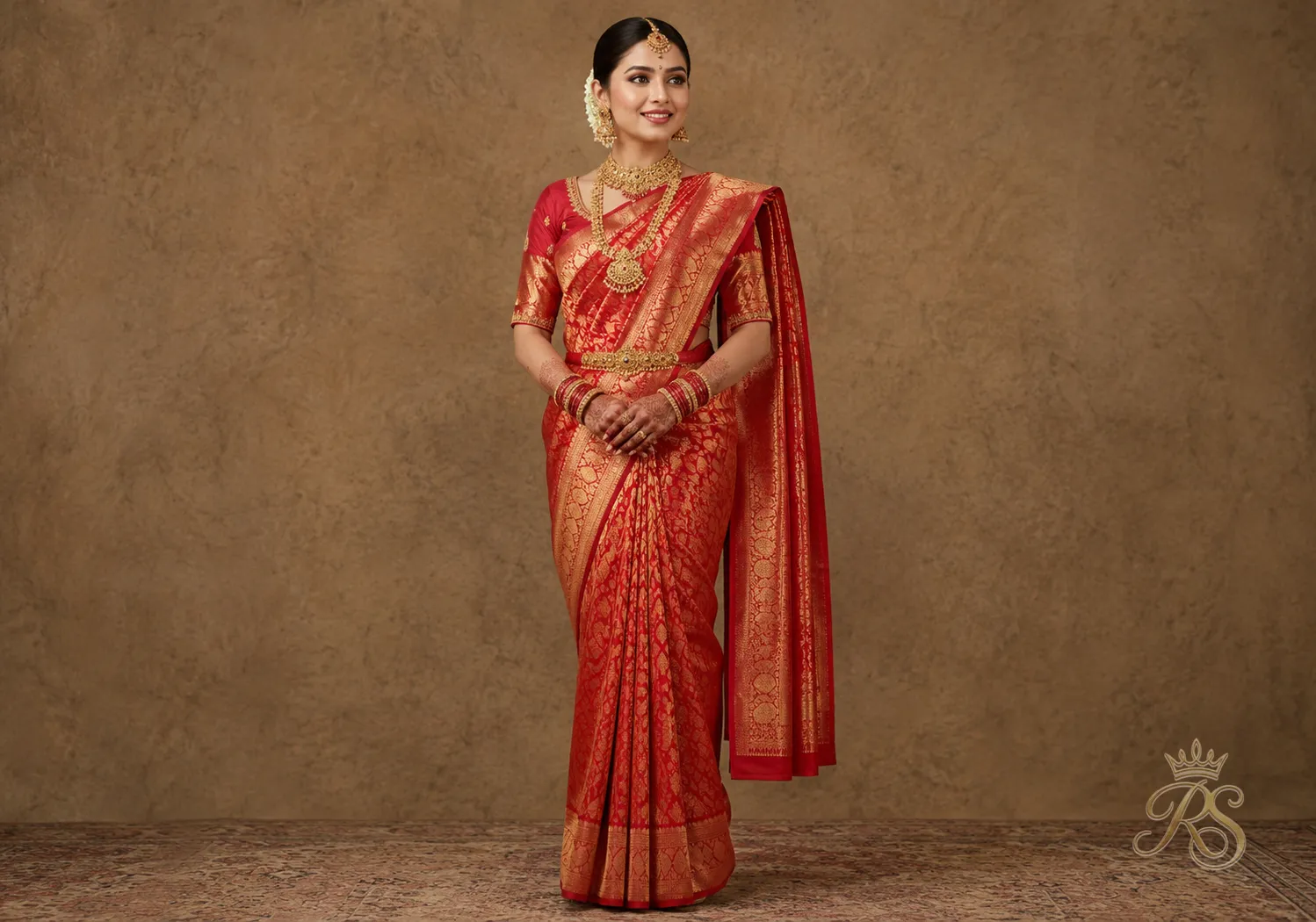 Bride wearing a traditional Nivi-inspired dupatta drape pinned over one shoulder