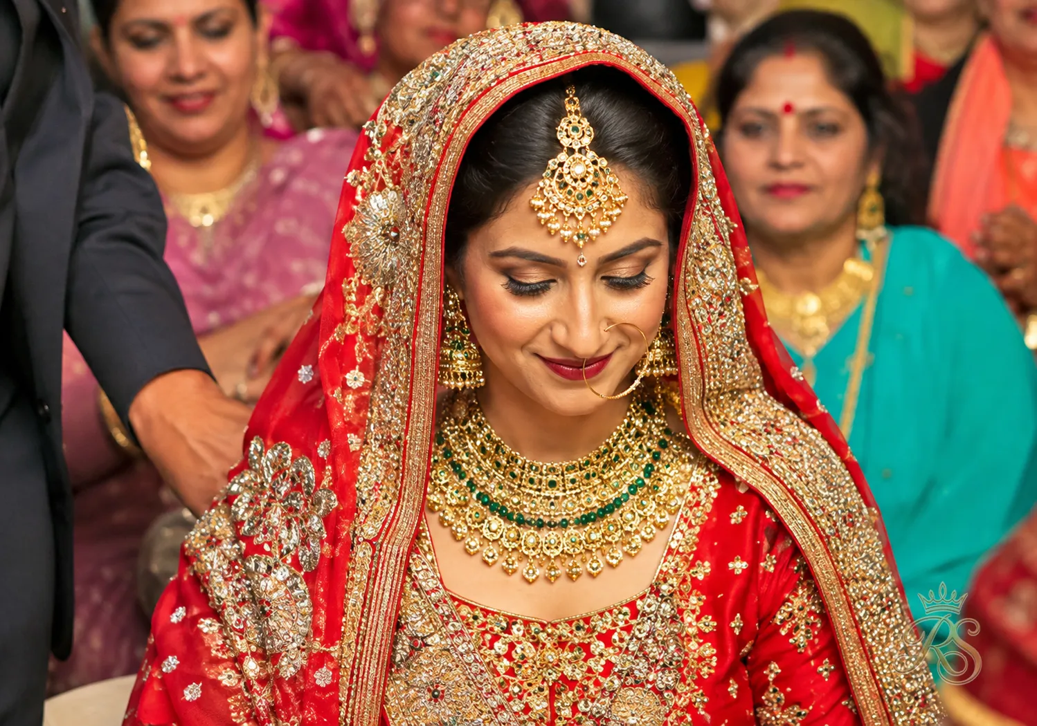 Punjabi bride wearing a traditional chunni draped over her head and shoulders