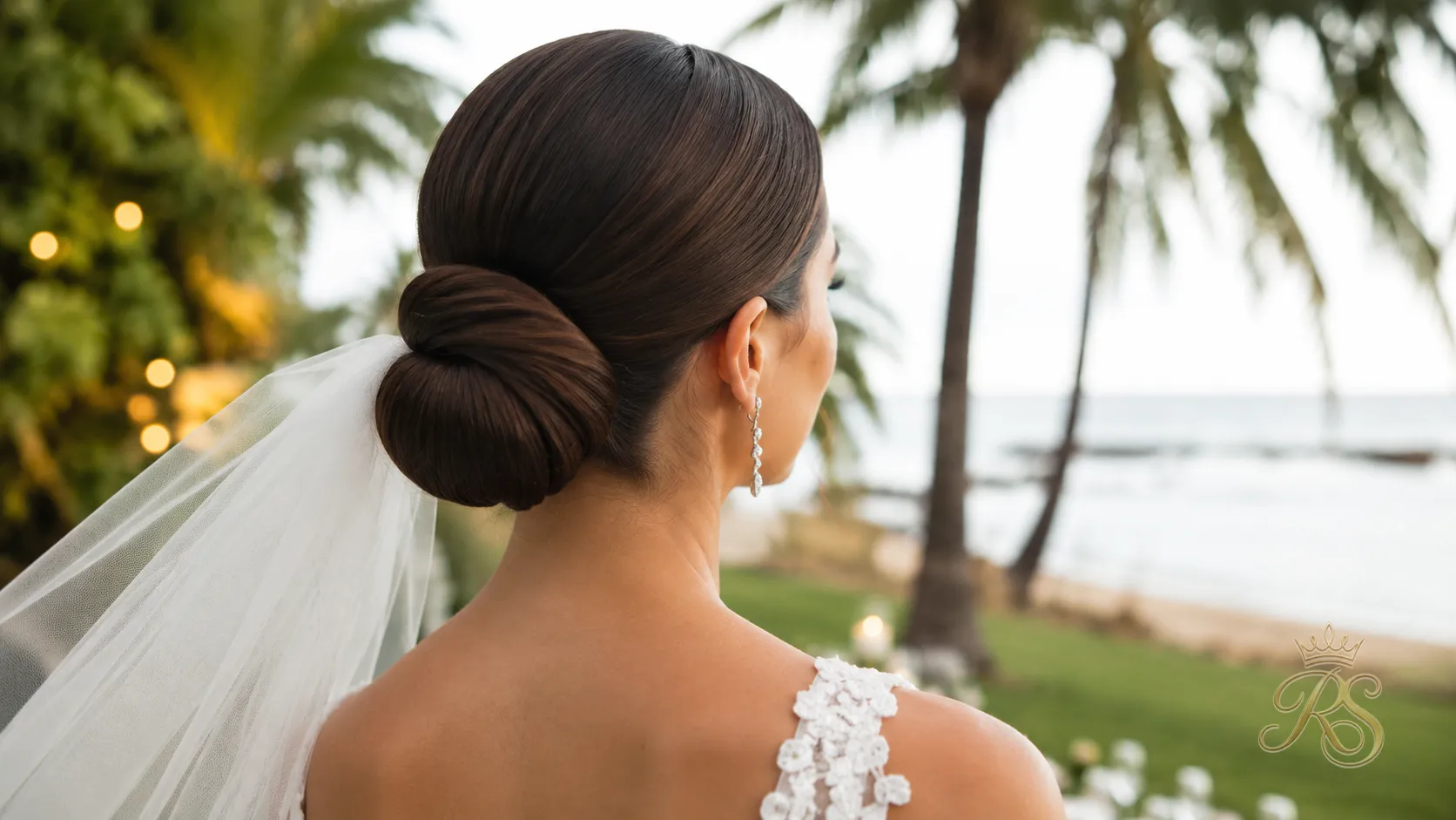 Bride with a smooth low bun designed to resist humidity at an outdoor wedding