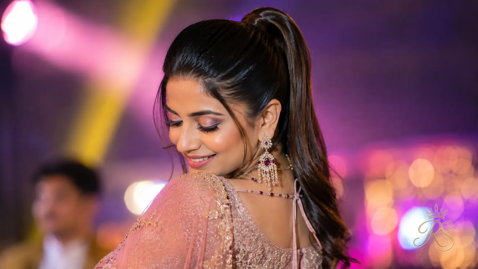 High ponytail with a sleek crown for sangeet dancing