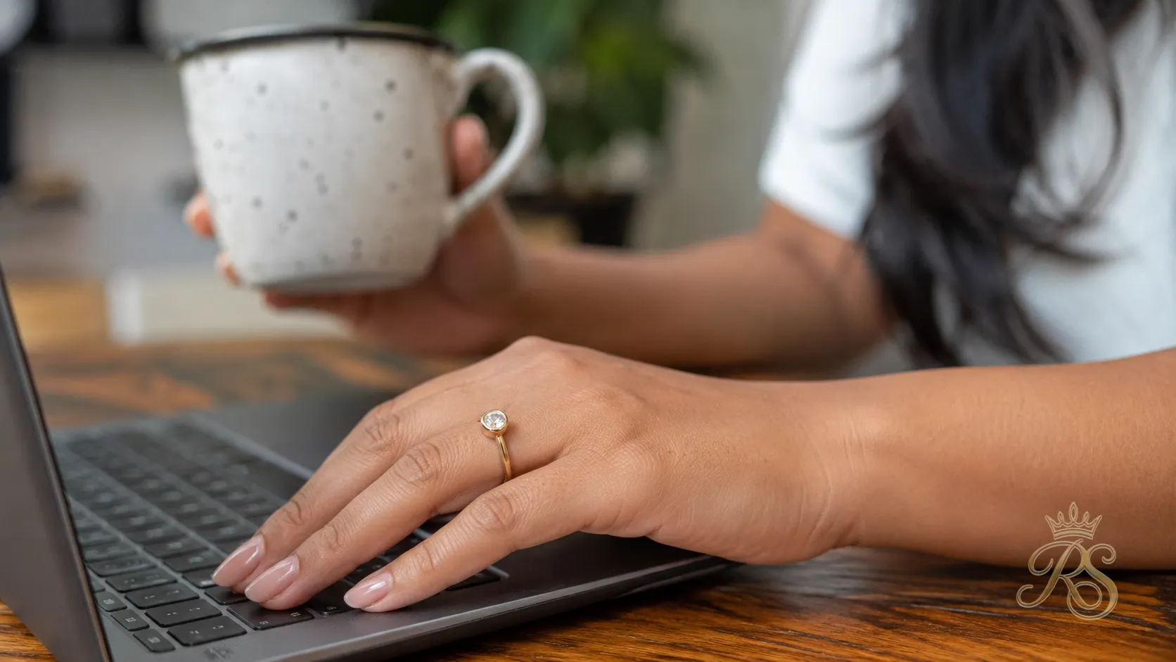 Low-profile engagement ring designed for an active lifestyle, shown on a hand mid-activity