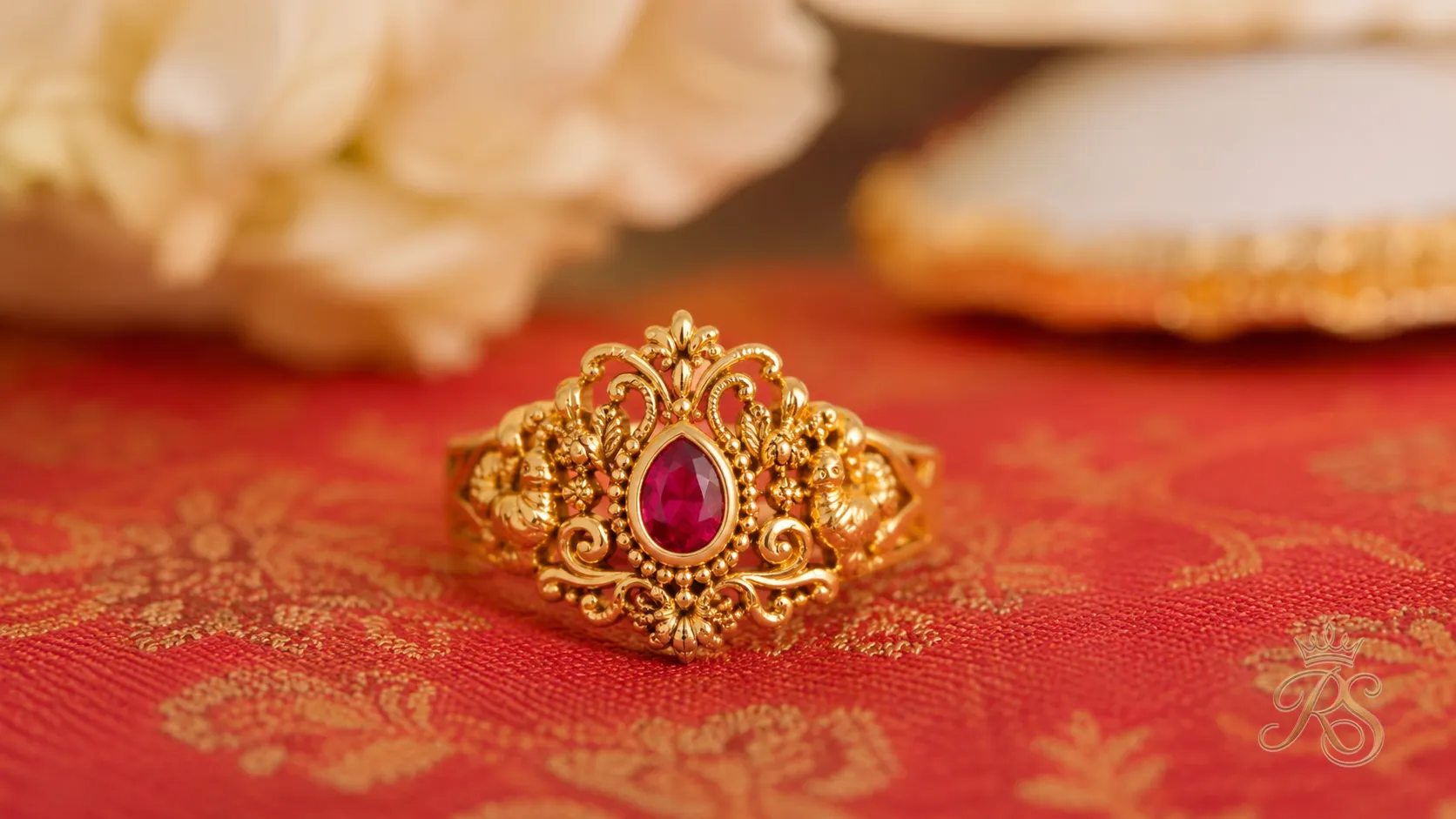 South Indian temple-style gold engagement ring with intricate filigree work