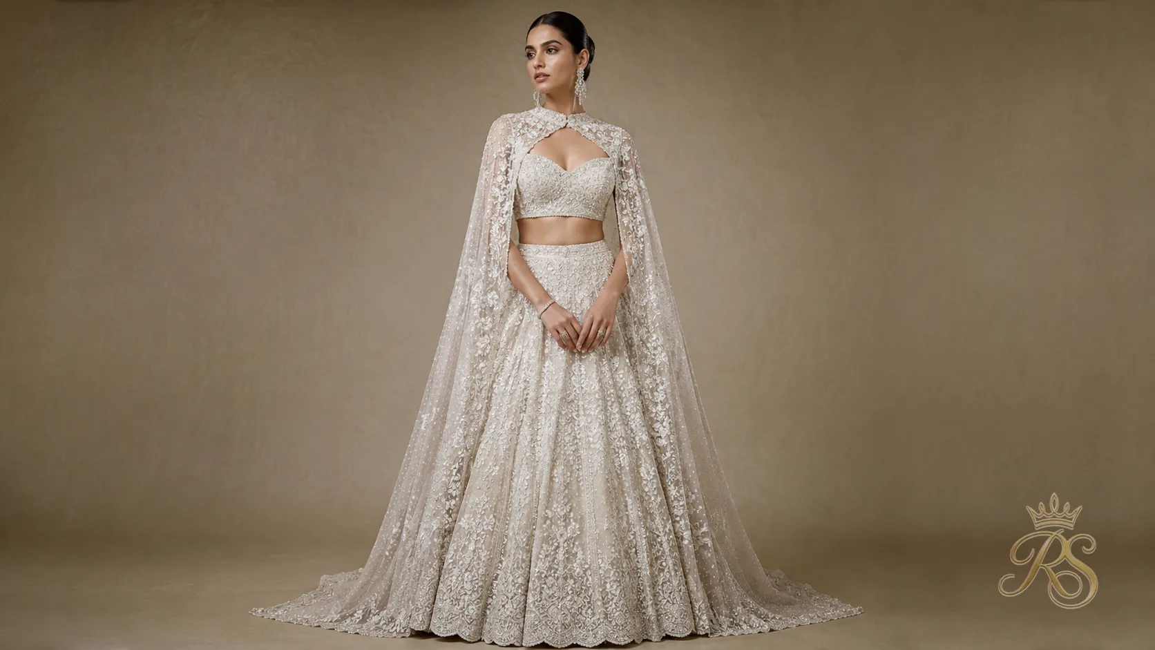Cape style bridal lehenga silhouette with dramatic detachable cape sleeves