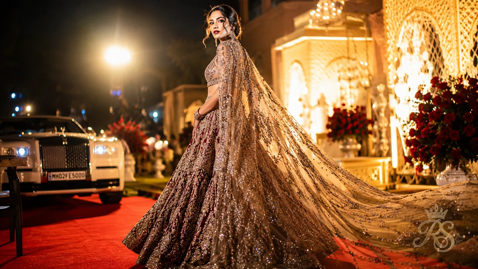 Falguni Shane Peacock style bridal lehenga with dramatic cape and crystal embellishment