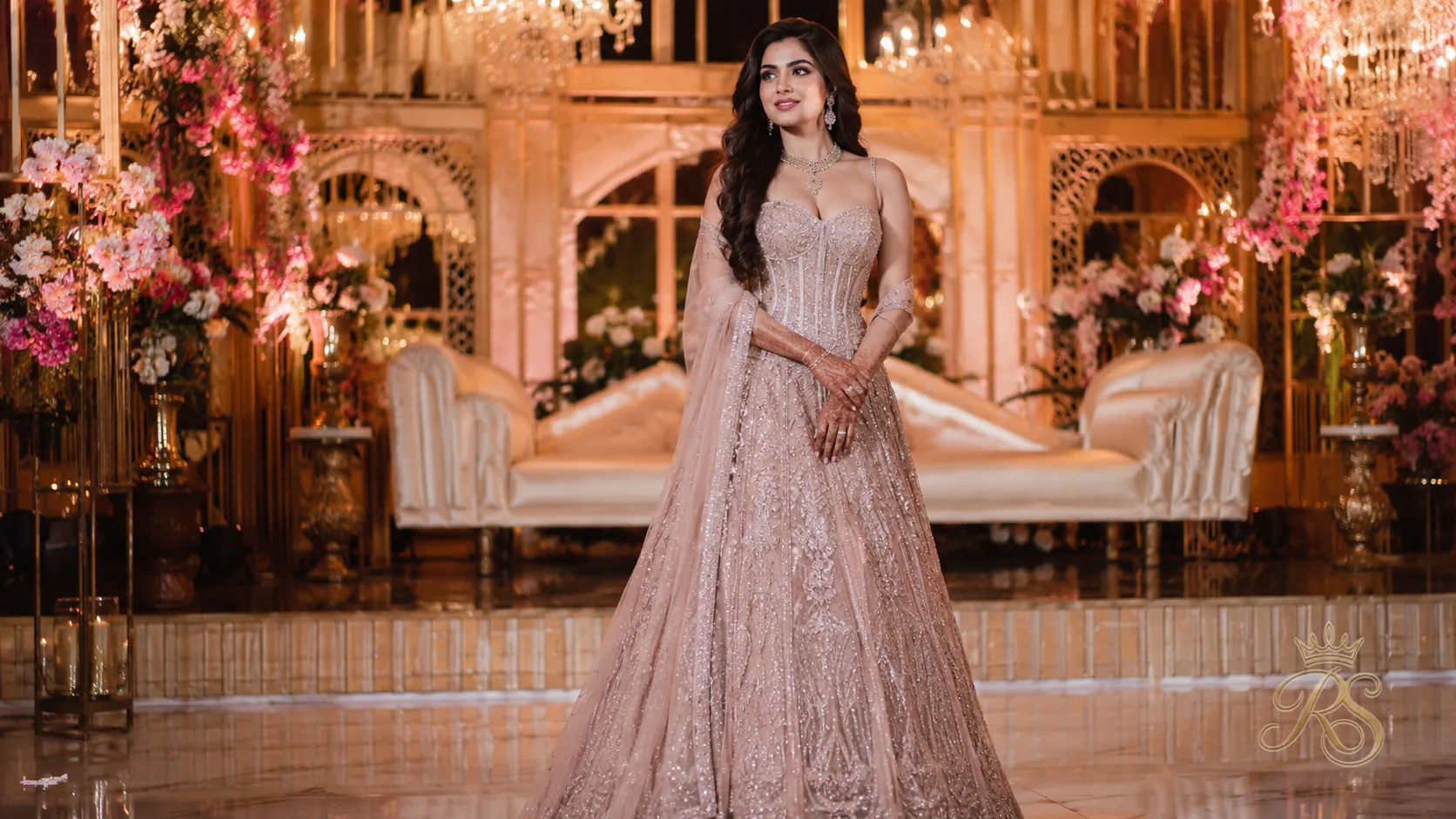 Reception lehenga styled as a fitted gown silhouette with corset blouse