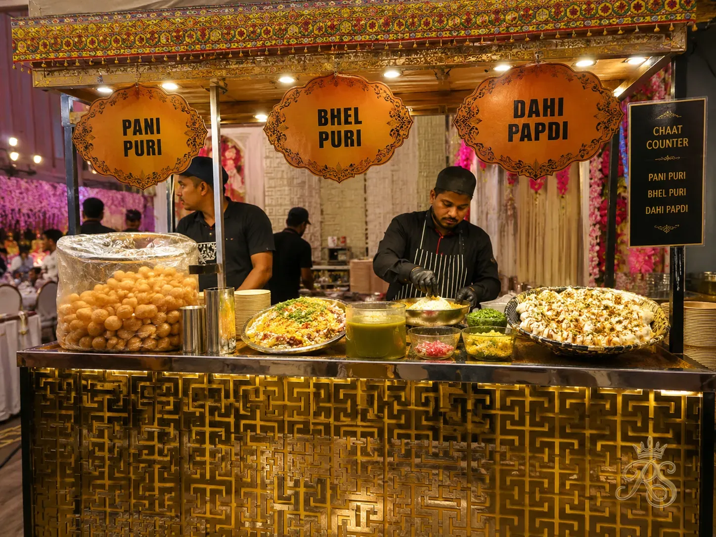 Colourful chaat counter at a wedding with pani puri, bhel puri and dahi papdi