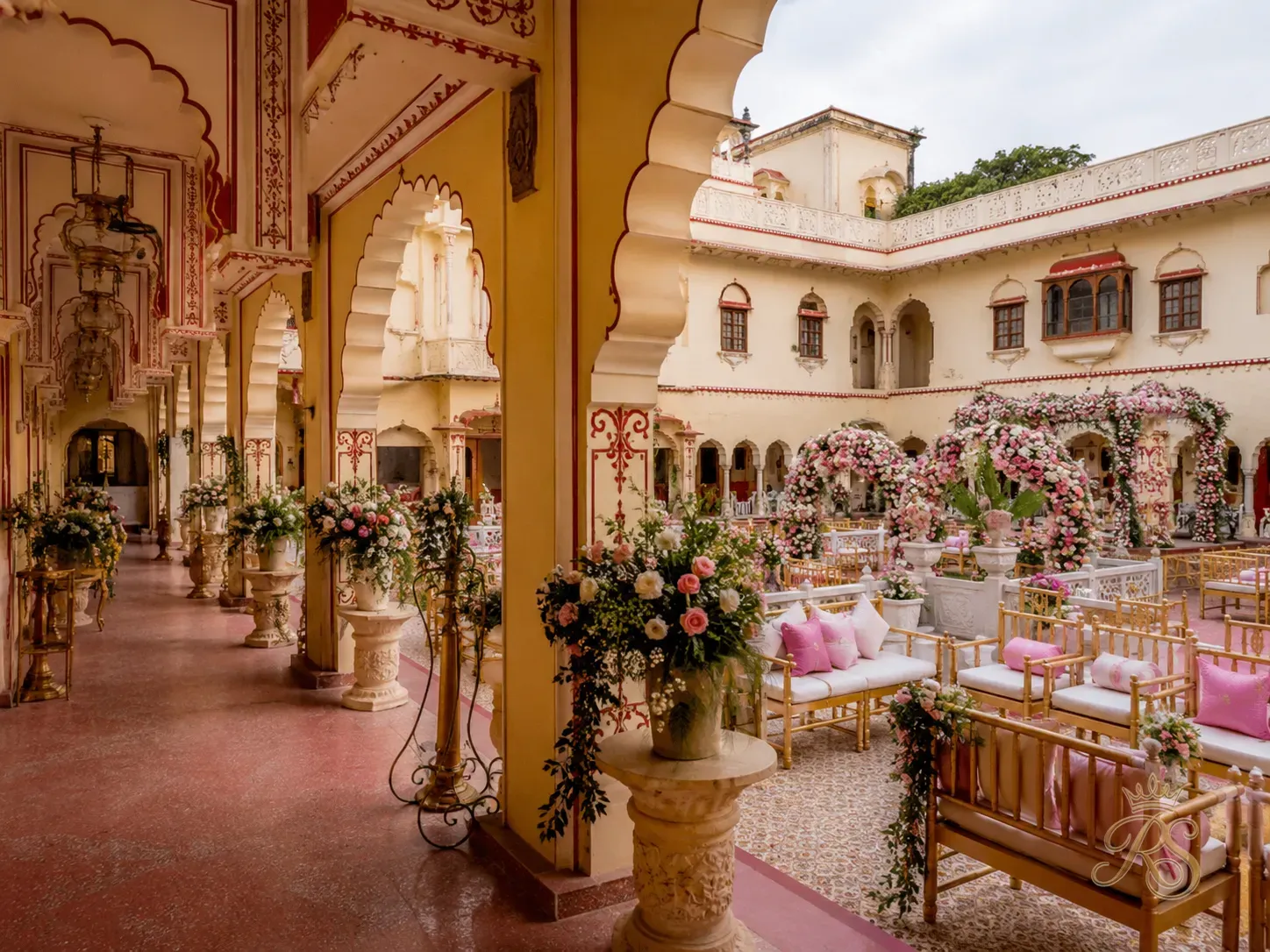 Heritage haveli wedding venue in Rajasthan with arched corridors and floral decoration