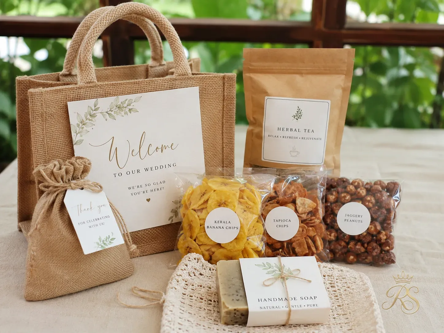 Wedding welcome kit with local snacks, herbal tea, and handmade soap in a jute bag
