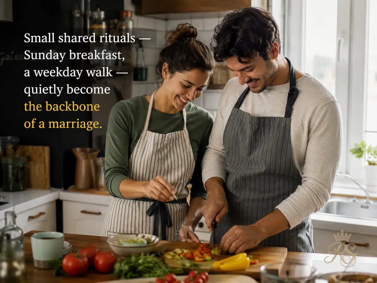 Young Indian married couple cooking together in a bright modern kitchen, laughing, casual home life