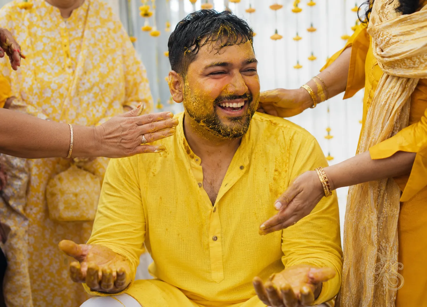 Groom in a bright yellow cotton kurta for the haldi ceremony