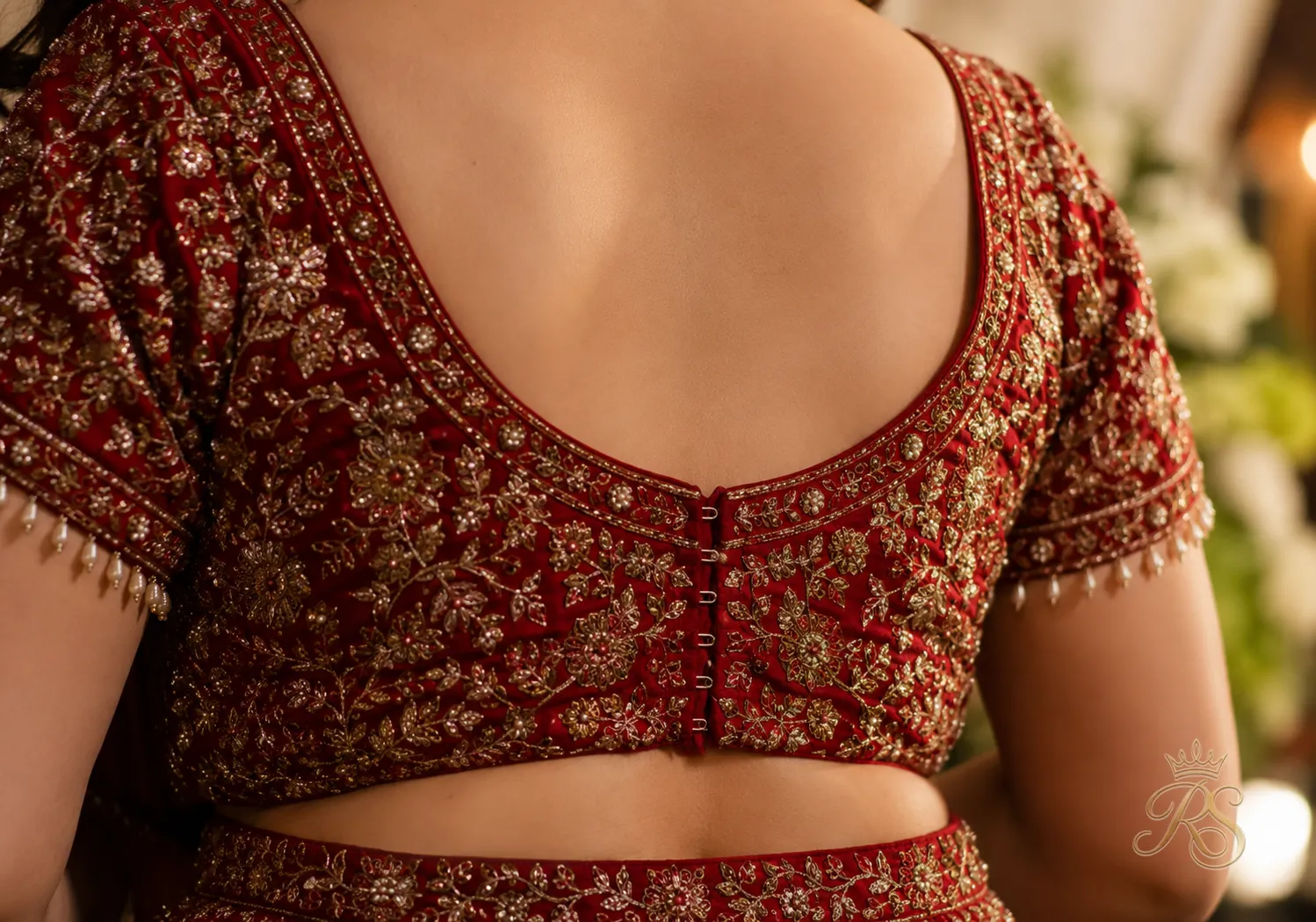 Close-up of a fitted bridal choli blouse with back hooks