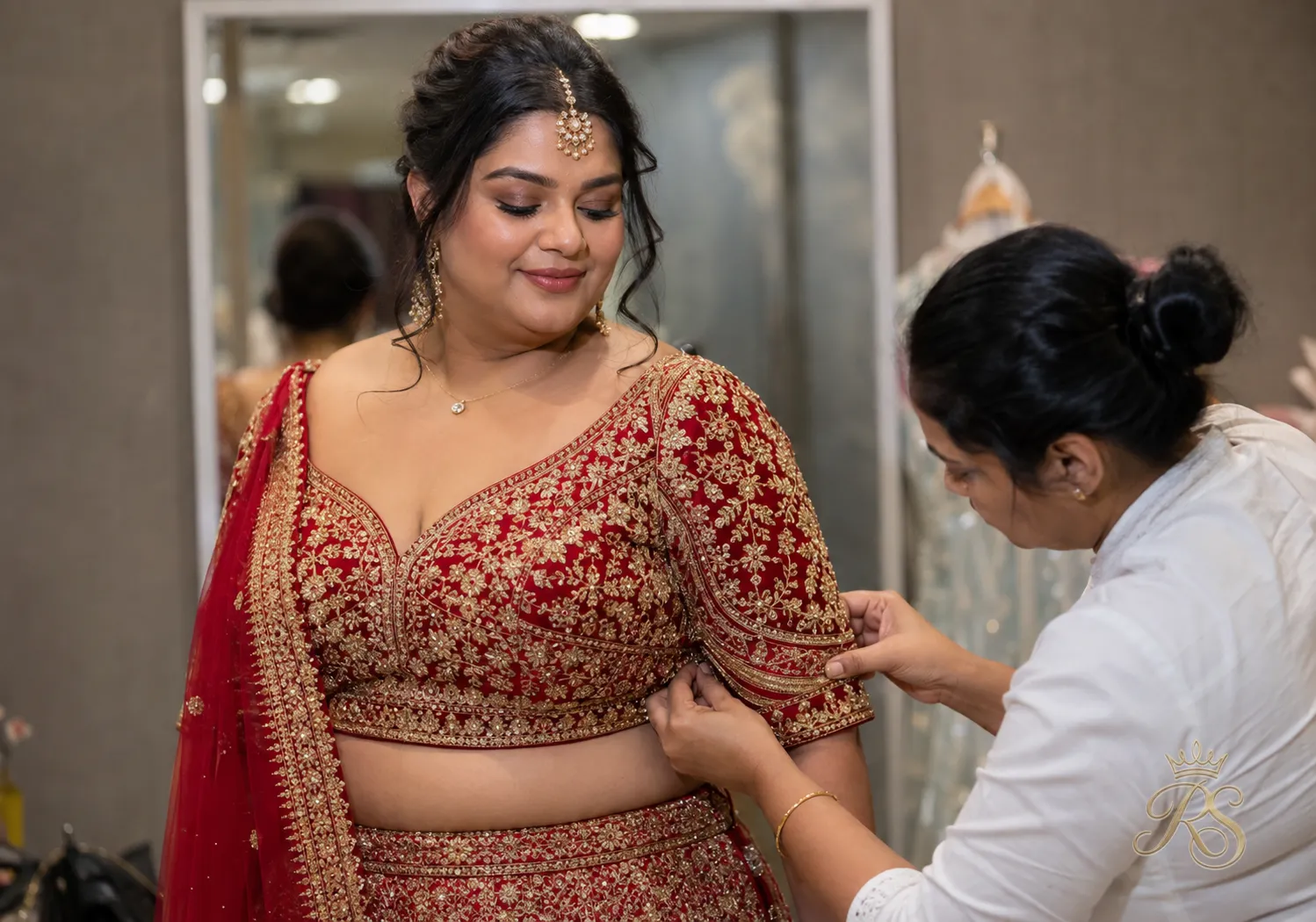 Bride at a last-minute fitting check close to her wedding date