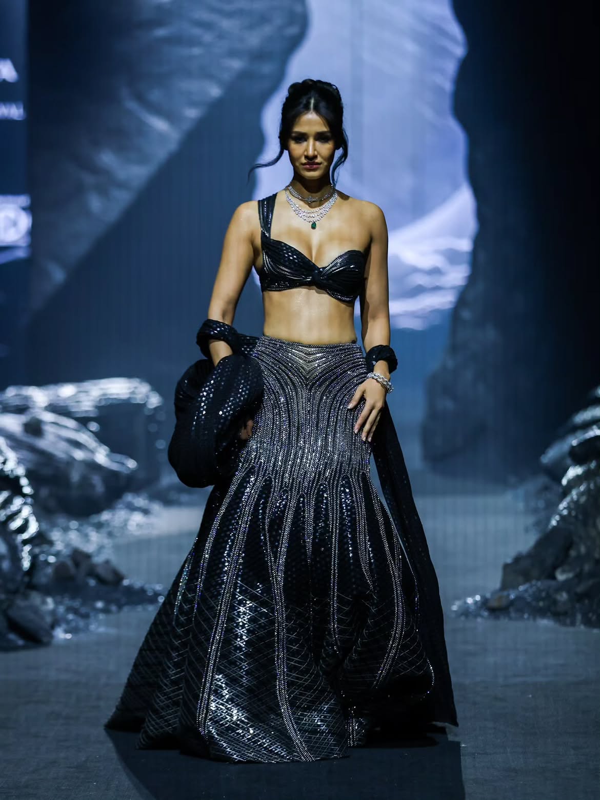 Disha Patani walks the runway for Indriya by Aditya Birla Jewellery X Amit Aggarwal in a metallic sequined bralette lehenga
