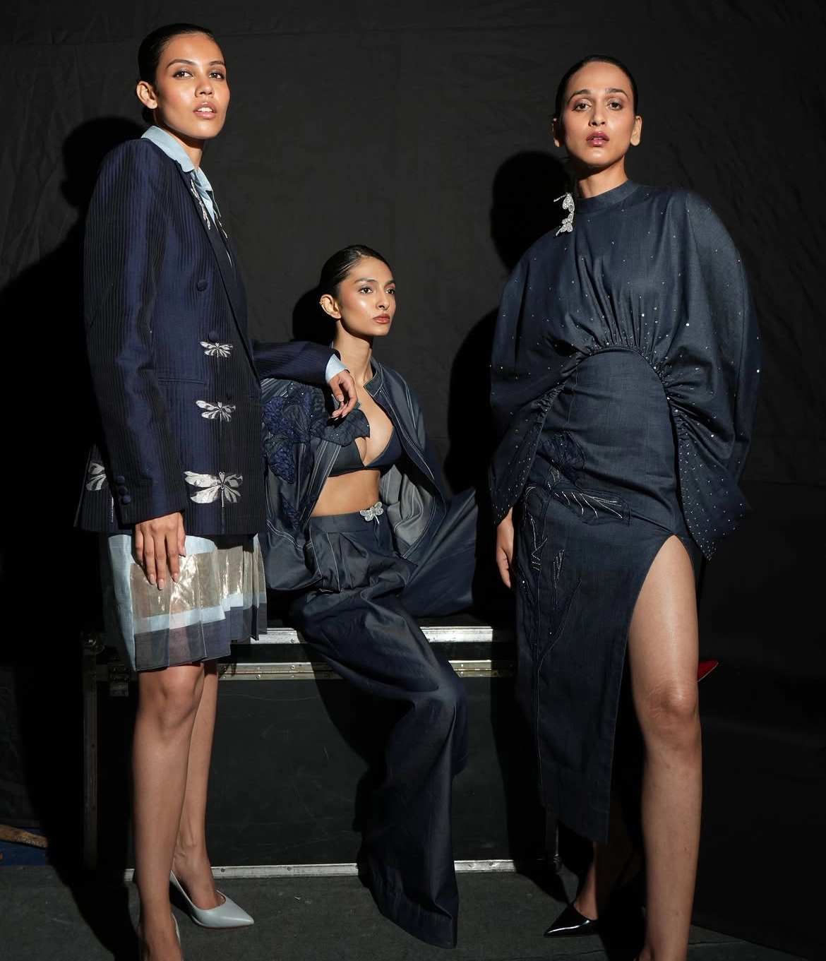 Backstage at Lakmē Fashion Week, models in embellished pinstripes ahead of the SUPIMA presents AFEW Rahul Mishra show