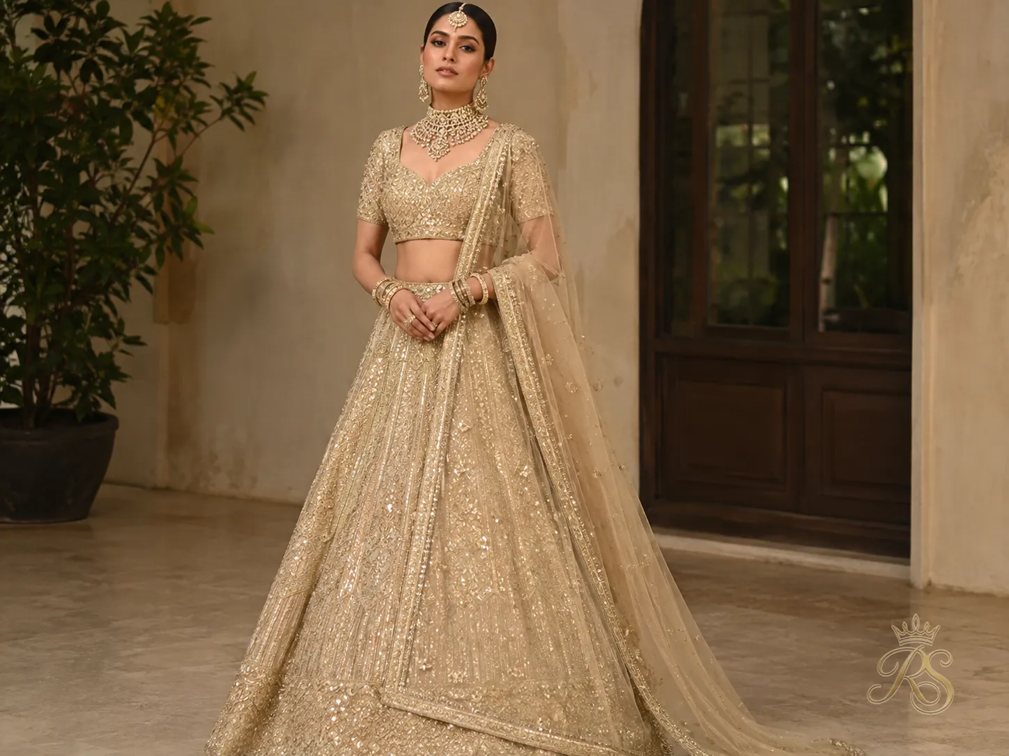 Champagne gold bridal lehenga with subtle metallic shimmer