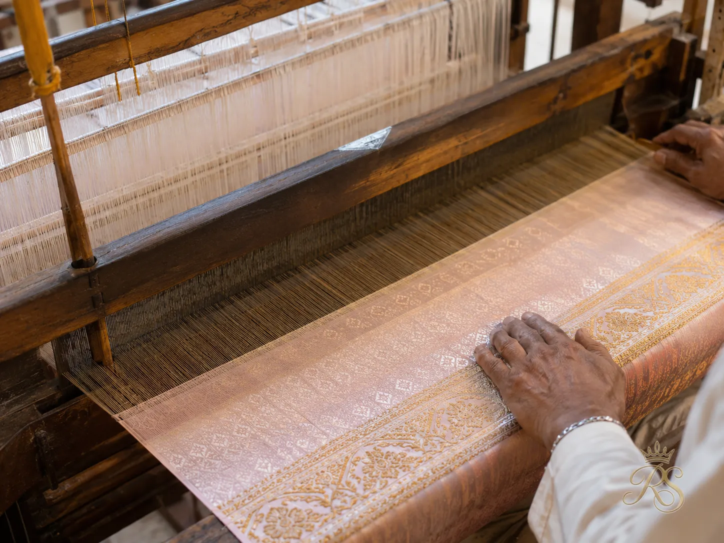Artisan weaving handloom silk fabric intended for a sustainable bridal lehenga