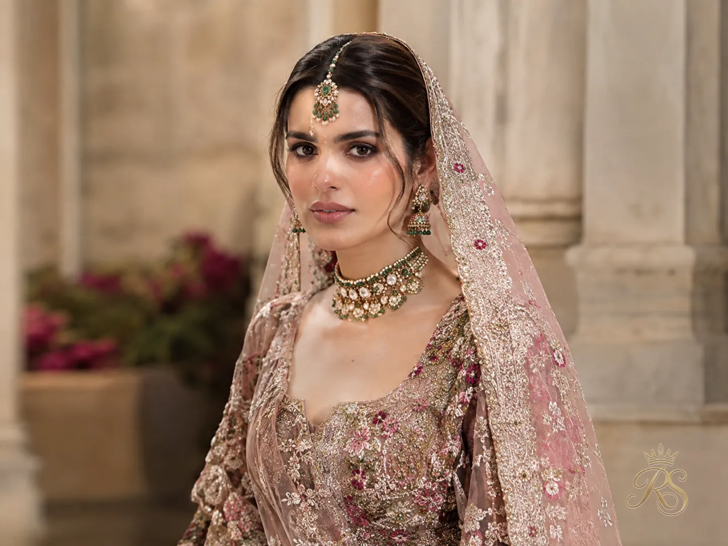 Minimal bridal jewelry styling trend paired with a heavily embroidered lehenga