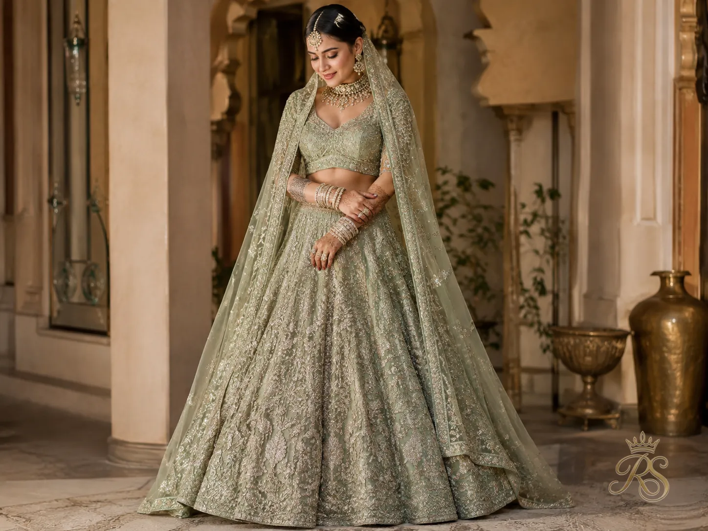 Sage green bridal lehenga with metallic thread embroidery