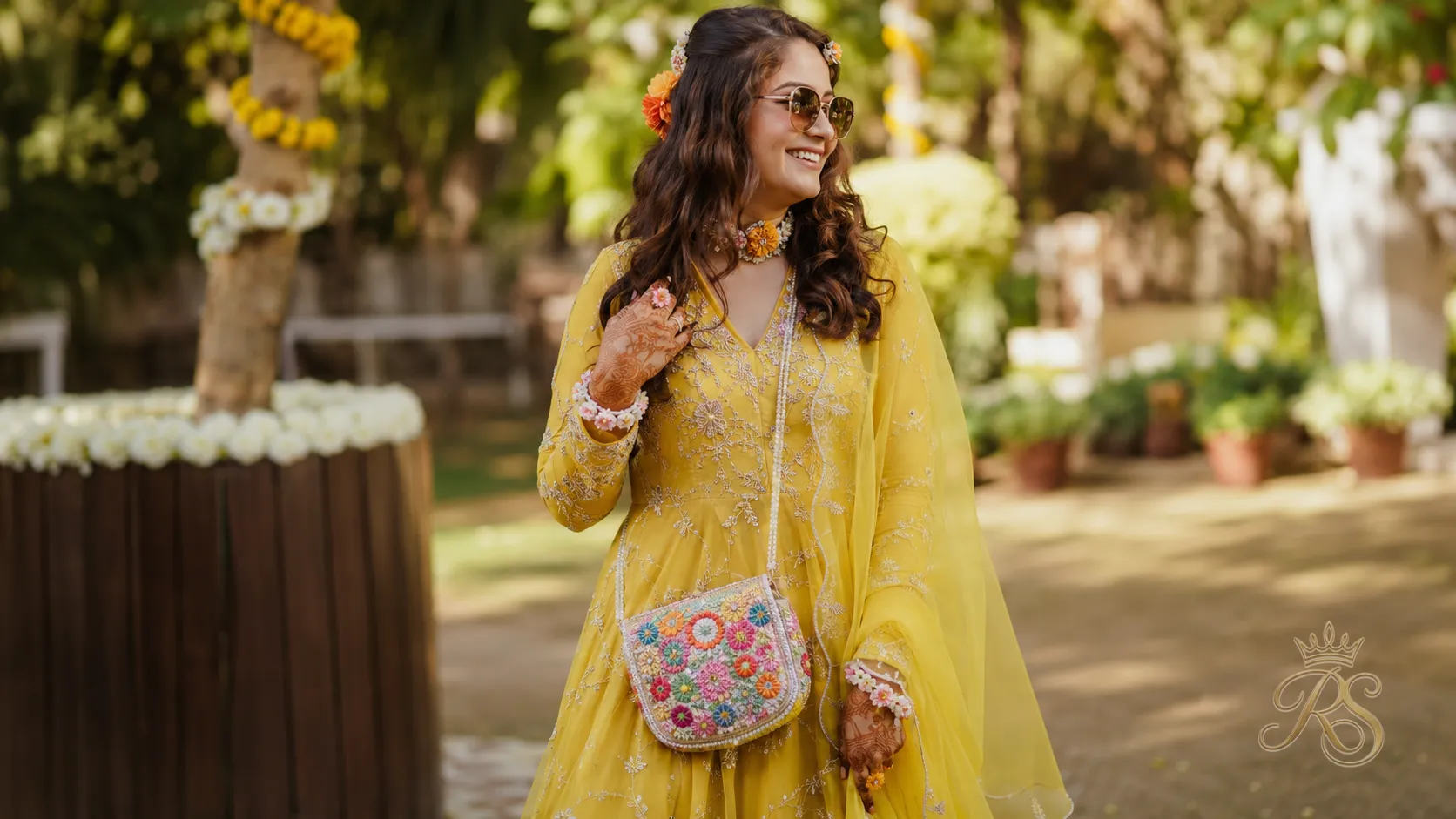 Floral beaded sling mini bag for a bridal mehendi look