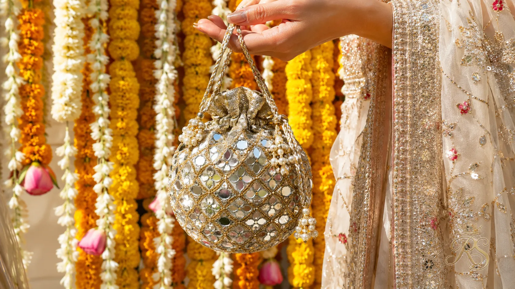 Mirror-work potli bag with drawstring for a mehendi outfit