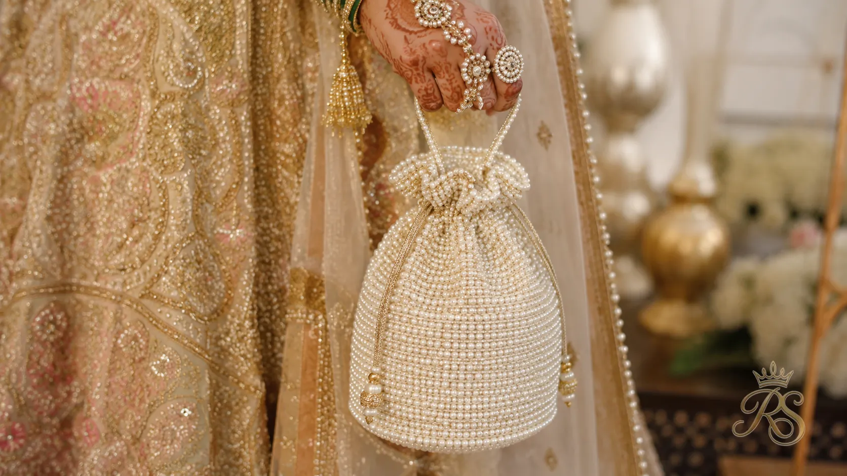 Pearl-embellished potli bag for a bridal wedding outfit