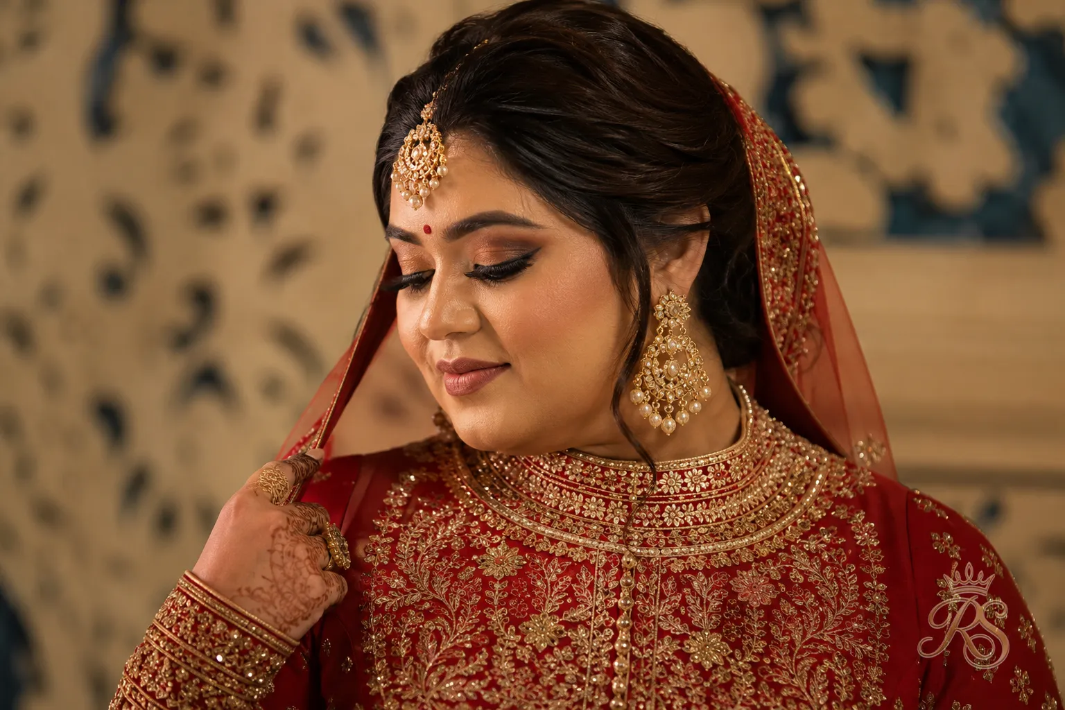 Plus size bride wearing a high-neck full-sleeve embroidered bridal blouse