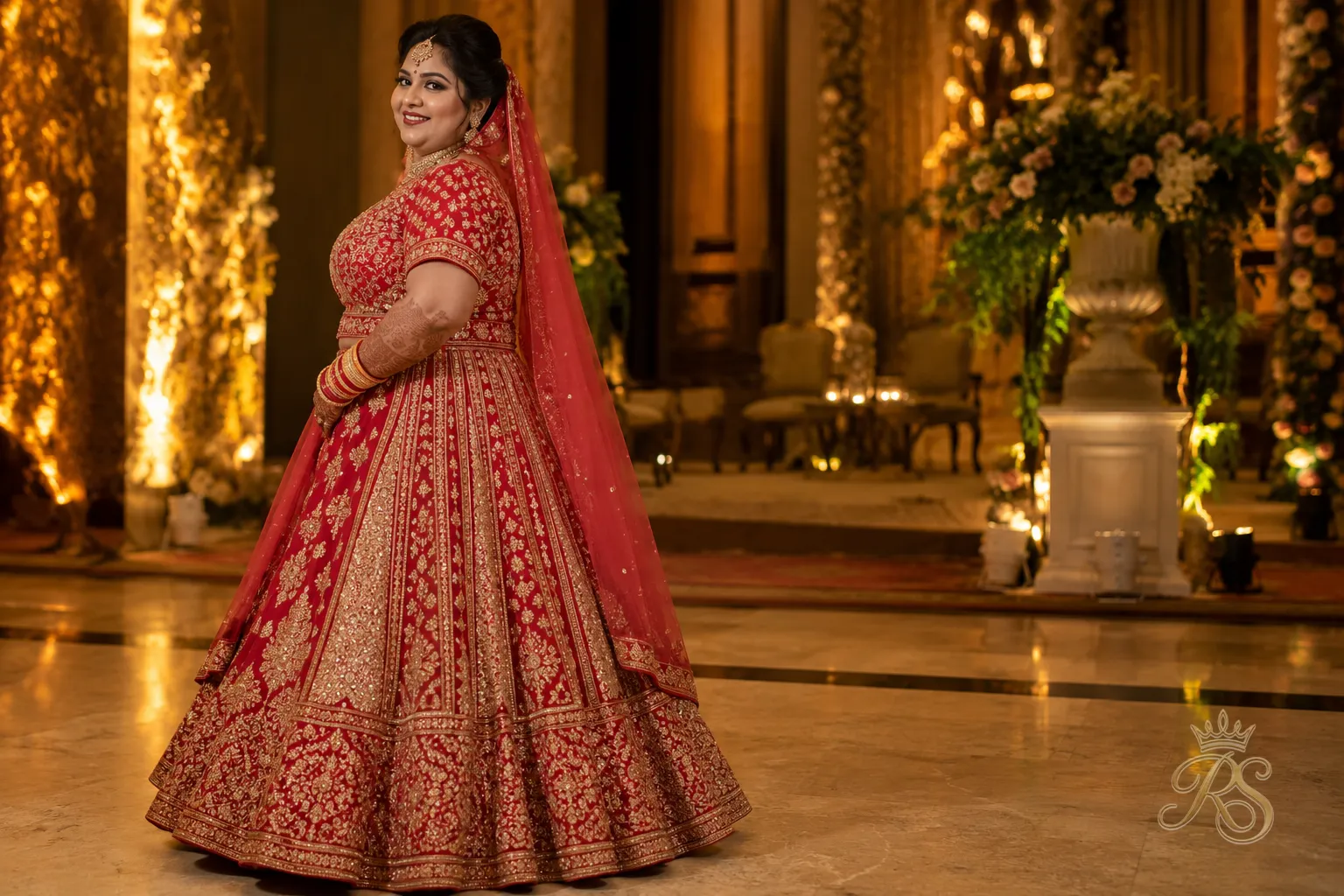 Plus size bride in a panelled flare lehenga with structured godets for volume