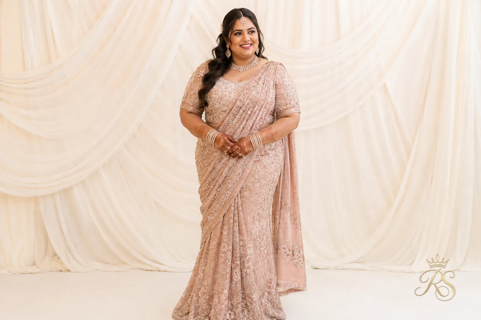 Plus size bride wearing a pre-stitched saree gown with an attached pallu