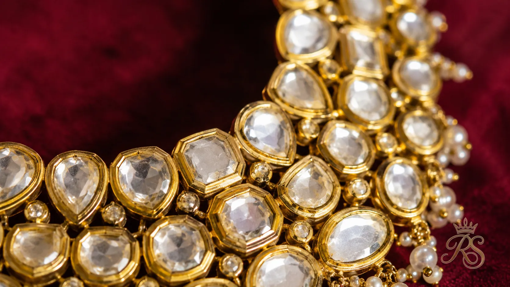 Macro shot of uncut polki diamonds set in gold foil bridal necklace