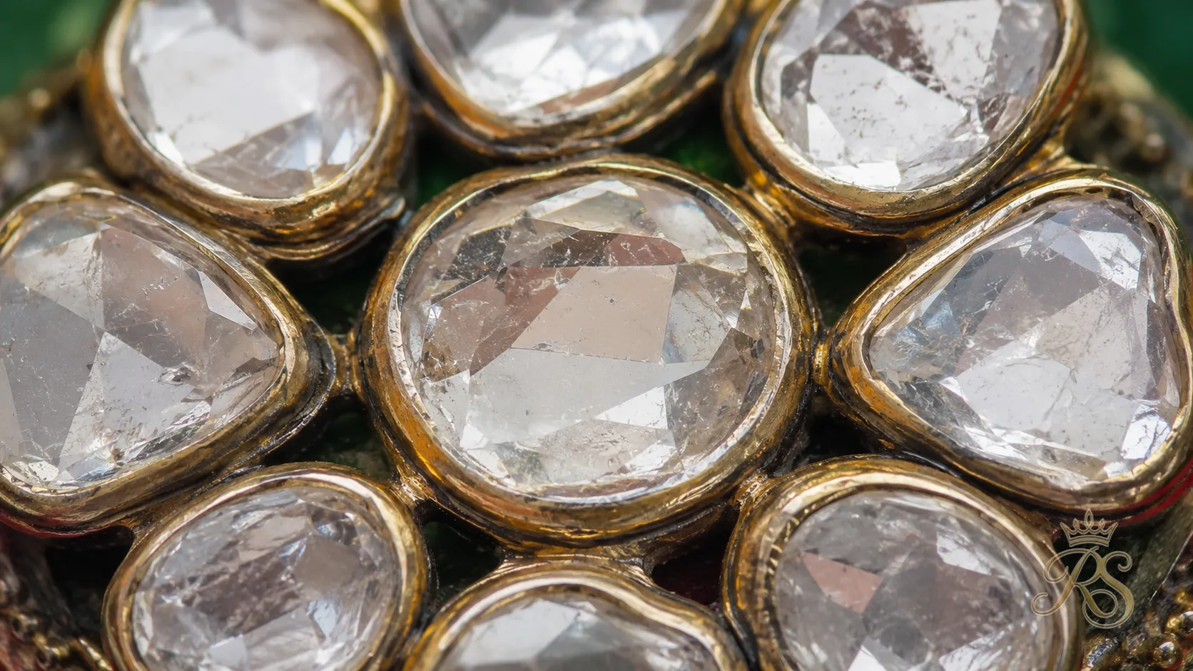Macro detail of hand-set uncut polki diamonds showing irregular natural facets