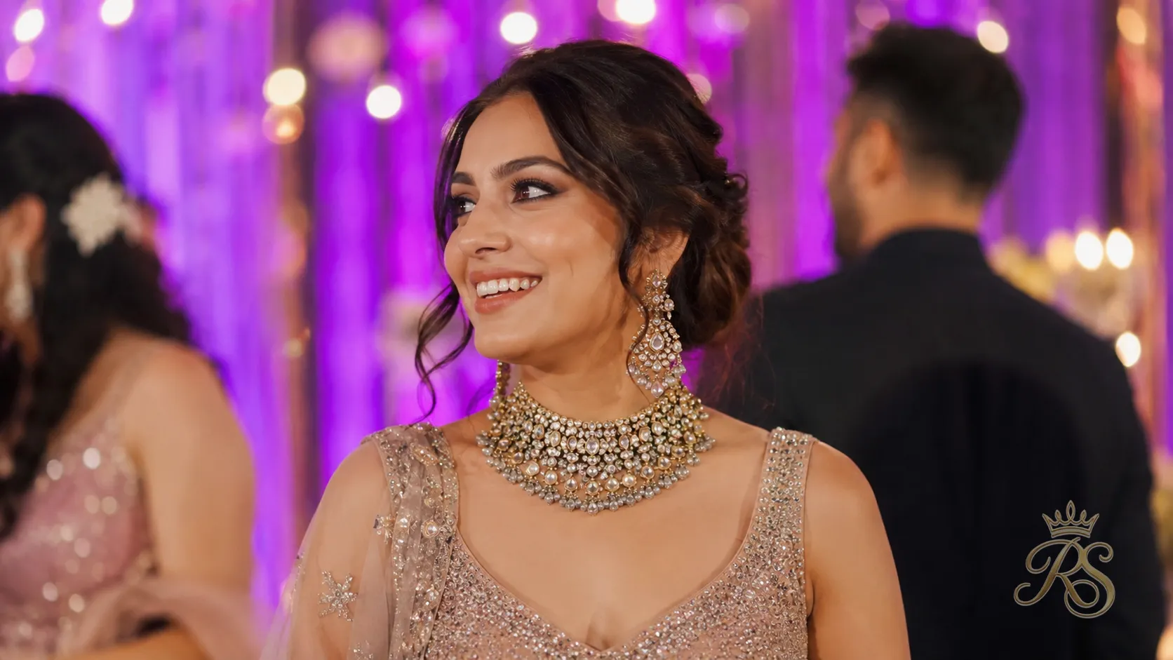 Bride at sangeet wearing a statement kundan choker and long earrings