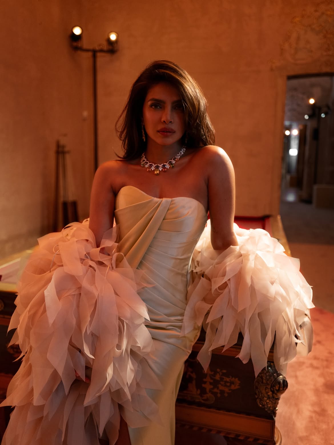 Priyanka Chopra in a champagne-toned gown with oversized ruffled organza sleeves and a statement necklace