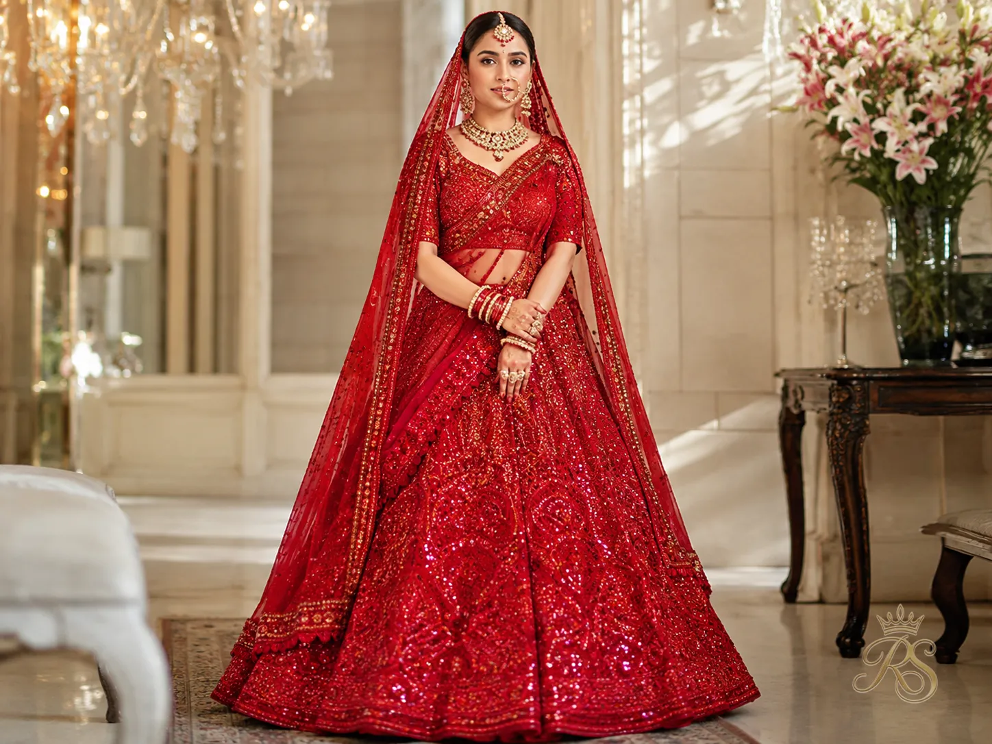 Fiery crimson bridal lehenga with vibrant sequin embellishment