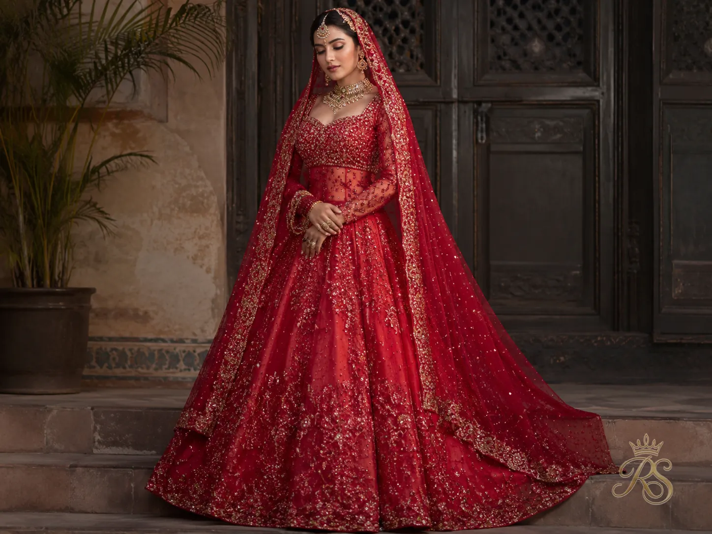 Red organza bridal lehenga layered with delicate sequin embroidery