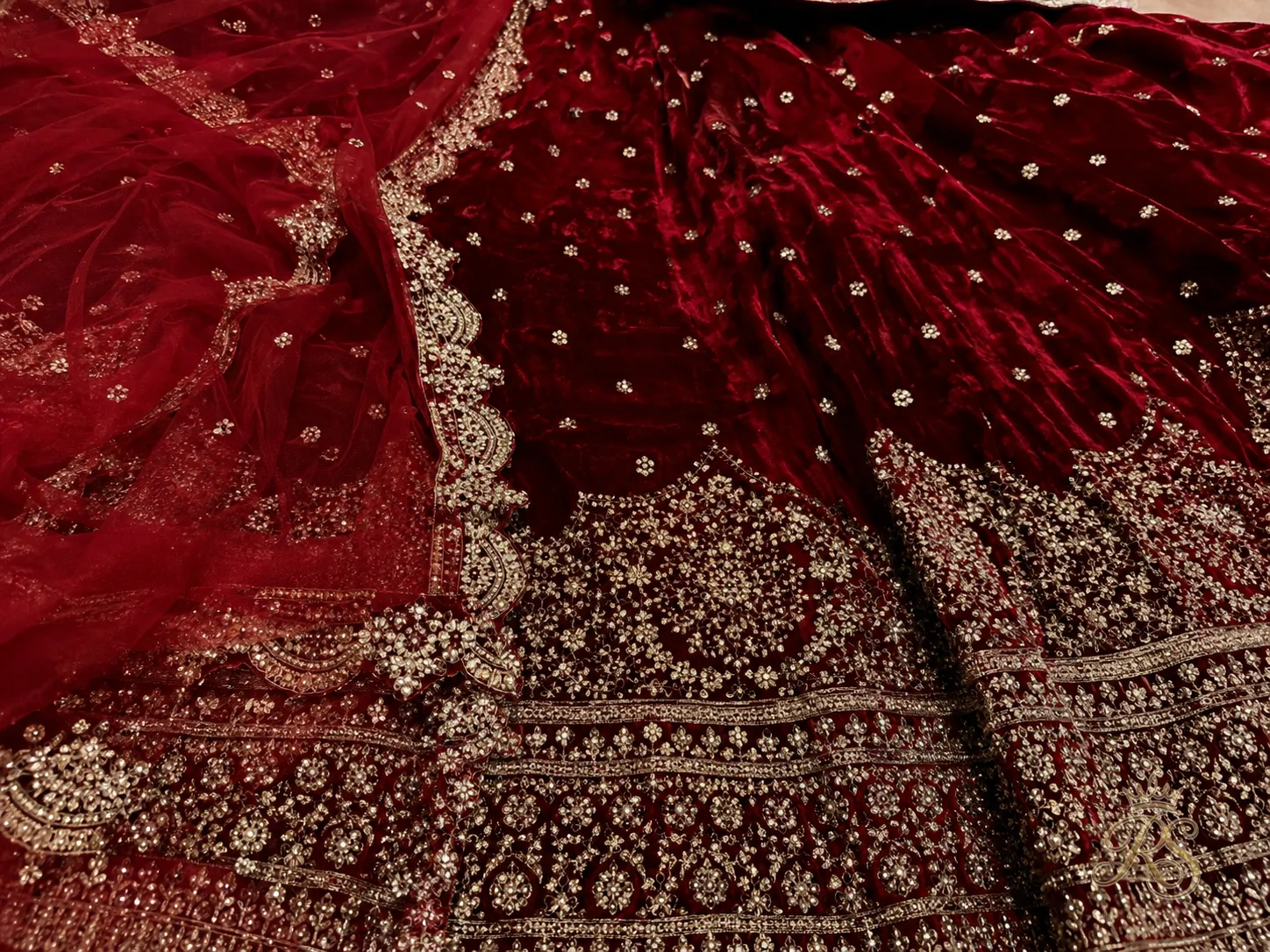 Rich red velvet fabric for a bridal lehenga suited to winter weddings