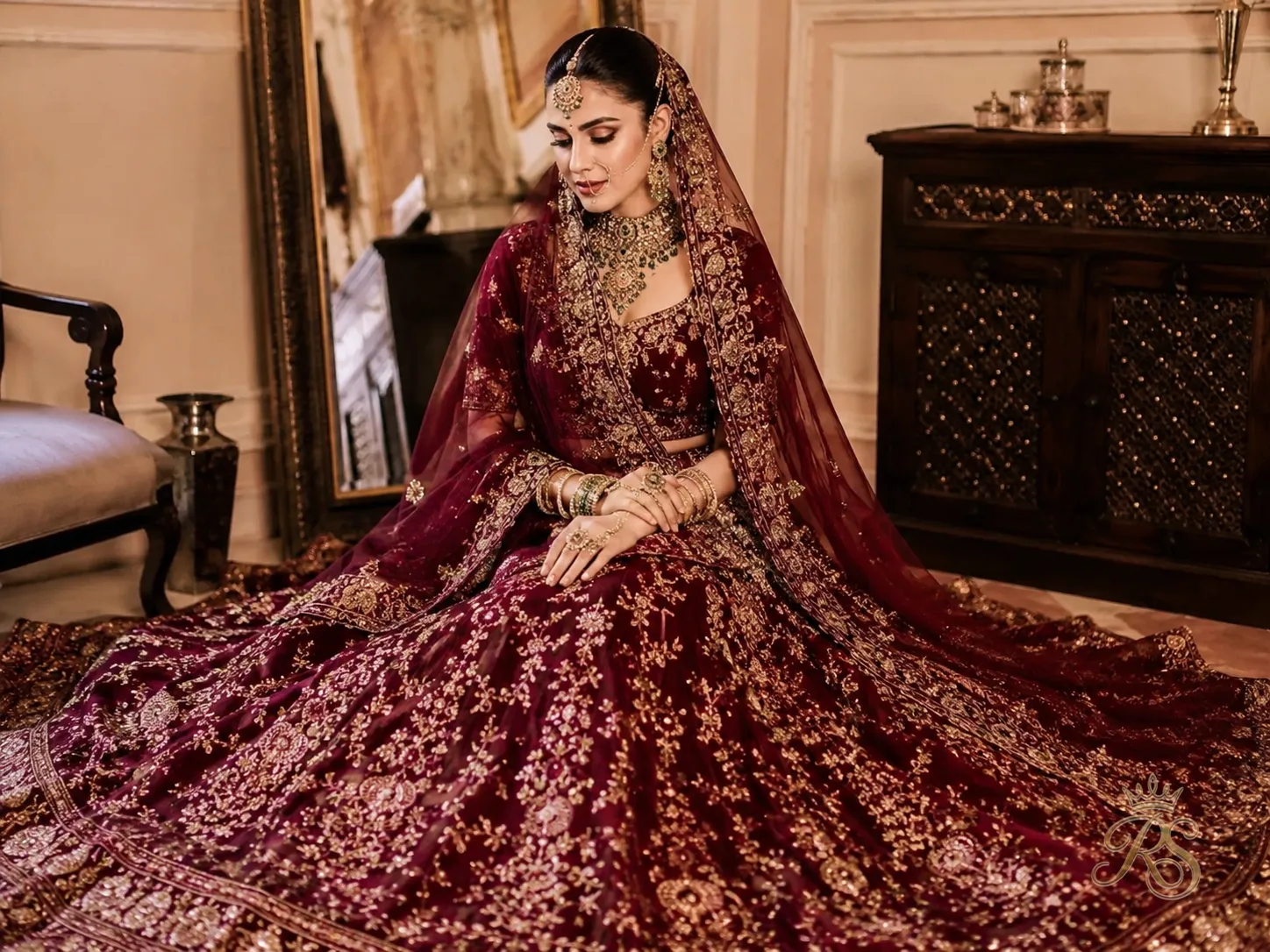 Wine and oxblood colored bridal lehenga with antique jewelry styling