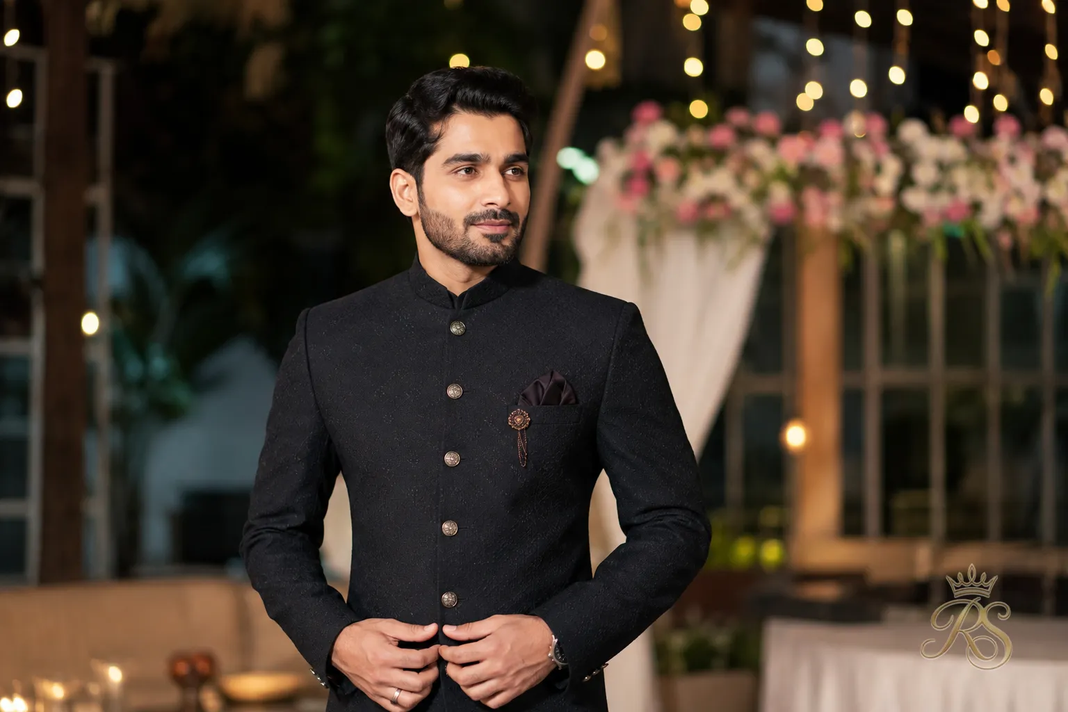 Groom in a contemporary fitted indo-western sherwani with a tailored waistline